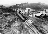 Two rakes of trucks at the Victoria Battery stone breakers. c.1940s